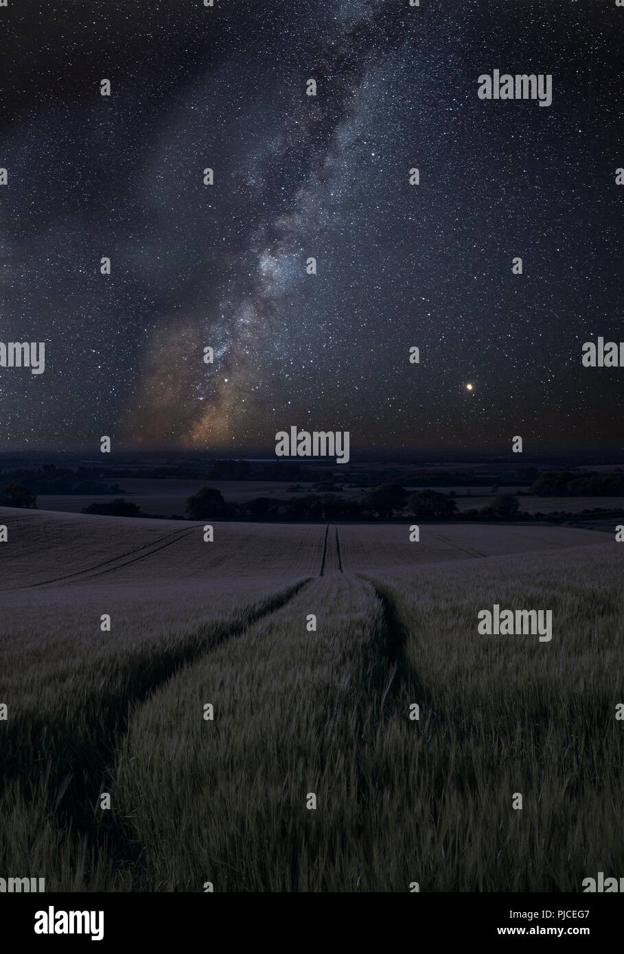Stunning vibrant Milky Way composite image over landscape of wheat ...
