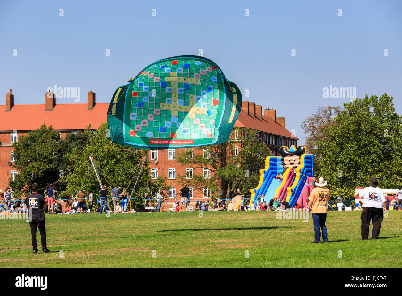 Brighton Kite Flyers fly a giant scrabble board kite at Streatham