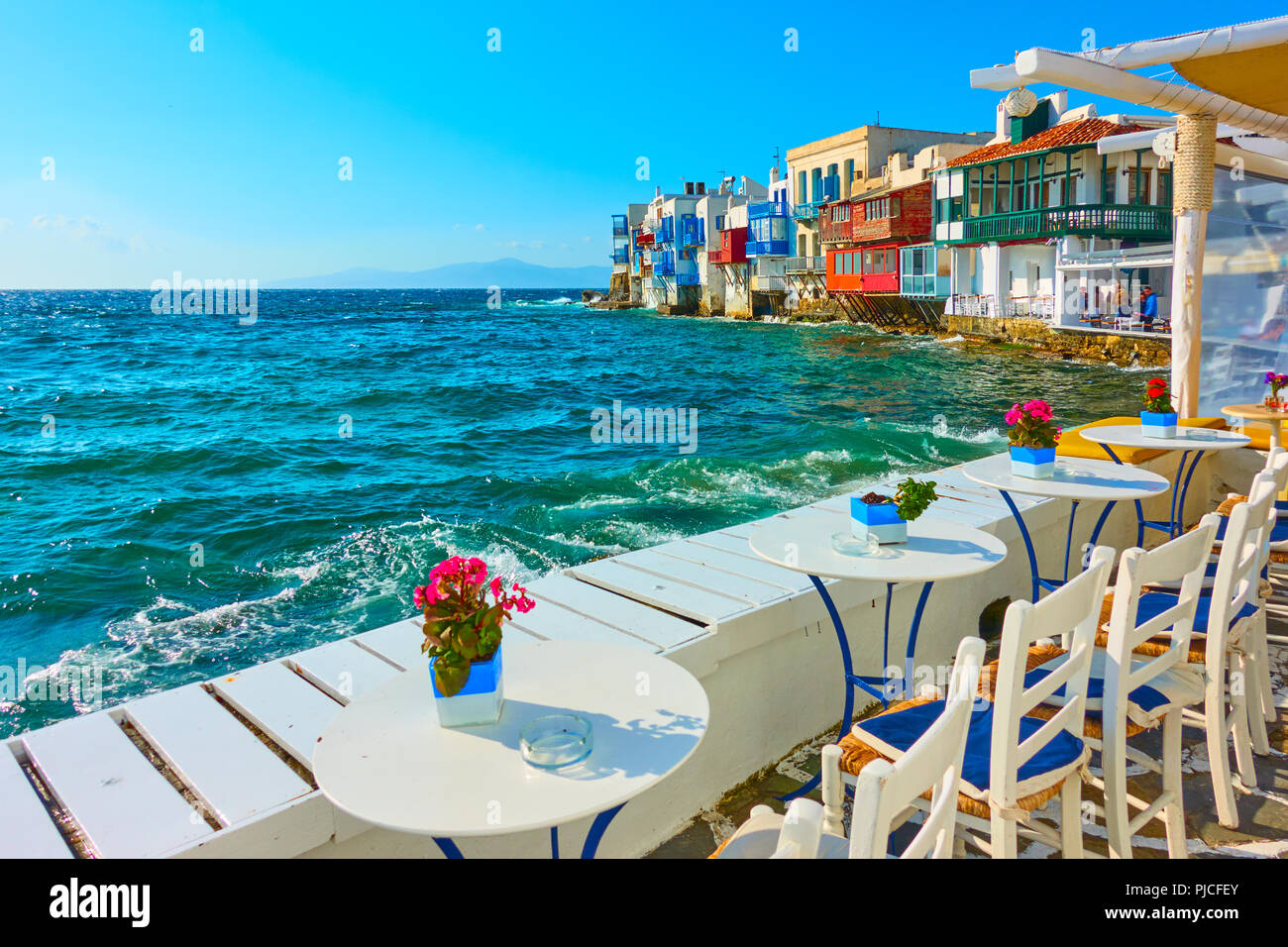 Small cafe by the sea next to The Little Venice district in Mykonos Island, Greece Stock Photo