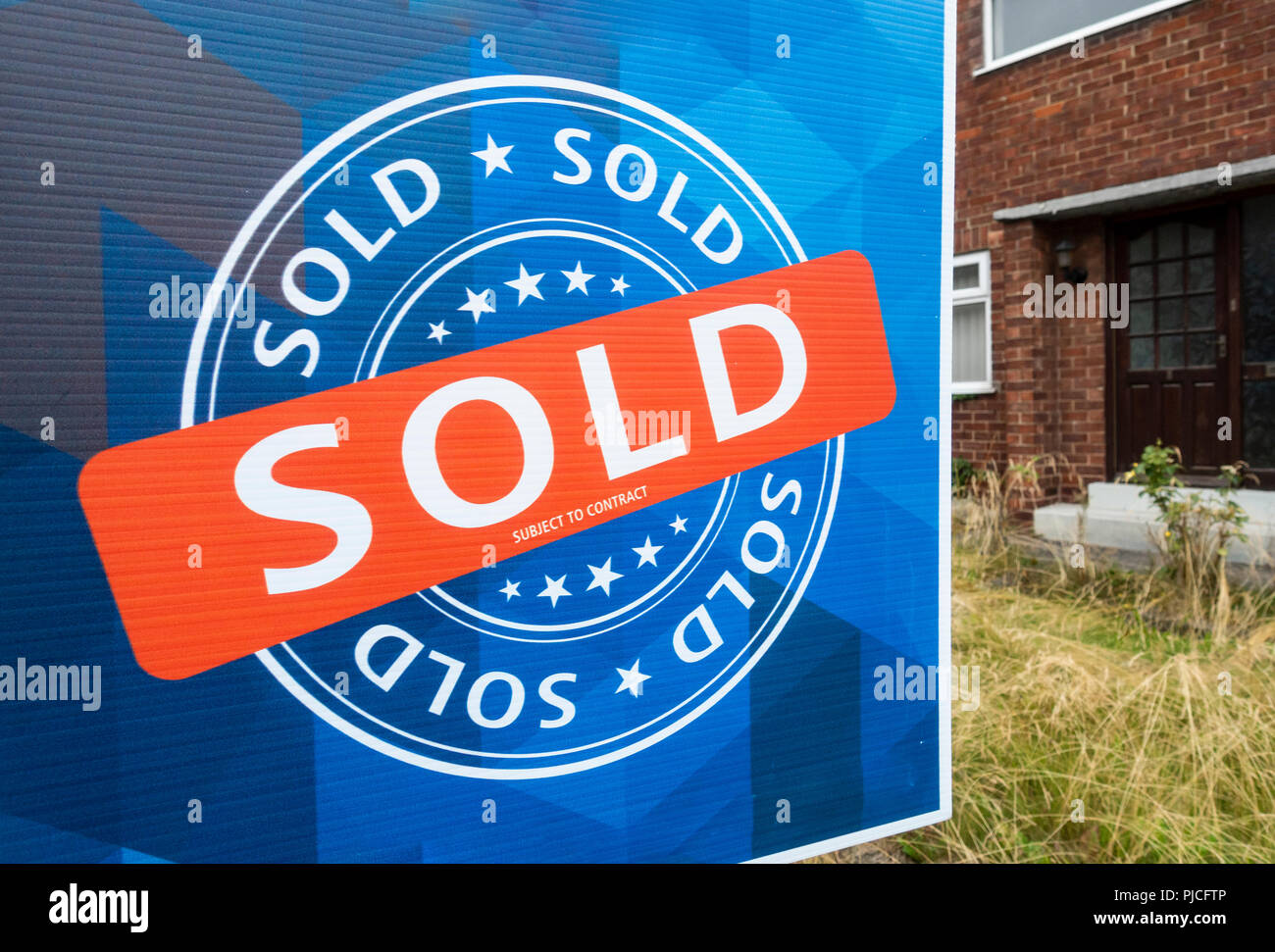 Sold sign outside bungalow in north east England. UK Stock Photo - Alamy