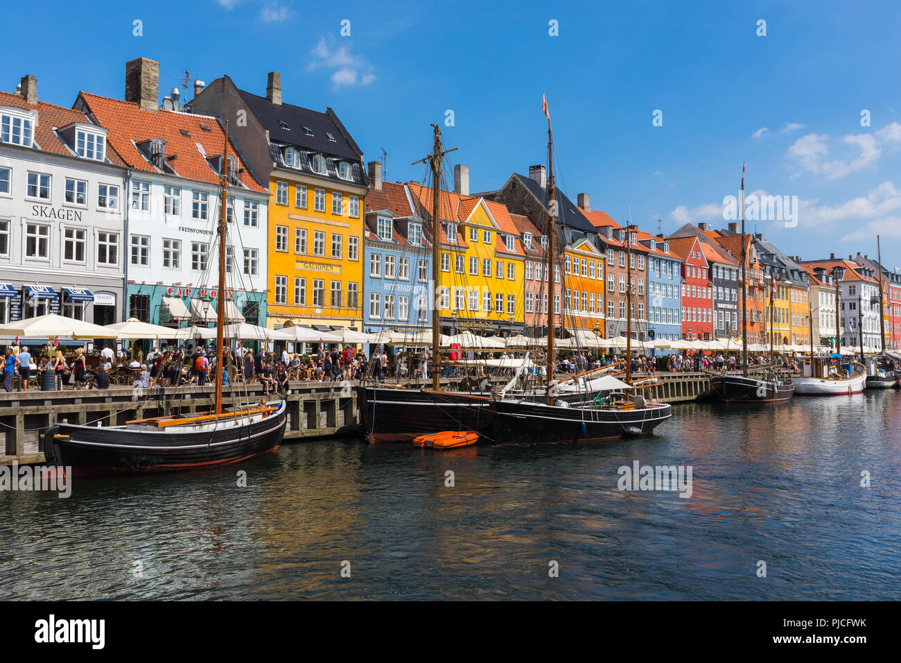 Nyhavn (New Harbour) is a 17th-century waterfront, canal and entertainment district in Copenhagen, Denmark. Stock Photo