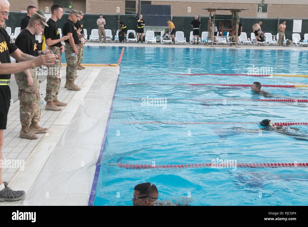 CAMP ARIFJAN, Kuwait – Two hundred and sixty-five ARCENT soldiers tried out for the German Armed Forces Proficiency Badge (GAFPB) at Camp Arifjan Kuwait. To qualify for the first event, a 100-meter swim in uniform must be successfully accomplished in less than four minutes. The swim challenge, held on July 9, was just one of the events in earning the GAFB. In the days to follow, Soldiers have to conduct a basic fitness test, ruck march and marksmanship competition in order to qualify for the badge. Stock Photo