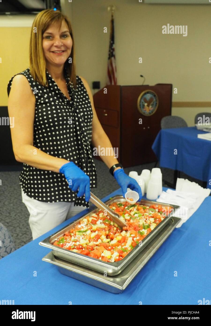 Julia Berry, registered nurse and a member of the NWIHCS Employee Wellness Committee, looks forward to serving up samples of spicy watermelon salad at the Healthy Food Event, July 19. Stock Photo