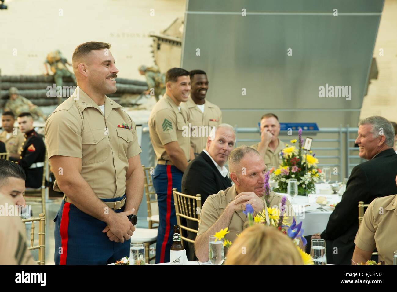 U.S. Marines on the Marine Corps Wrestling Team stand for recognition