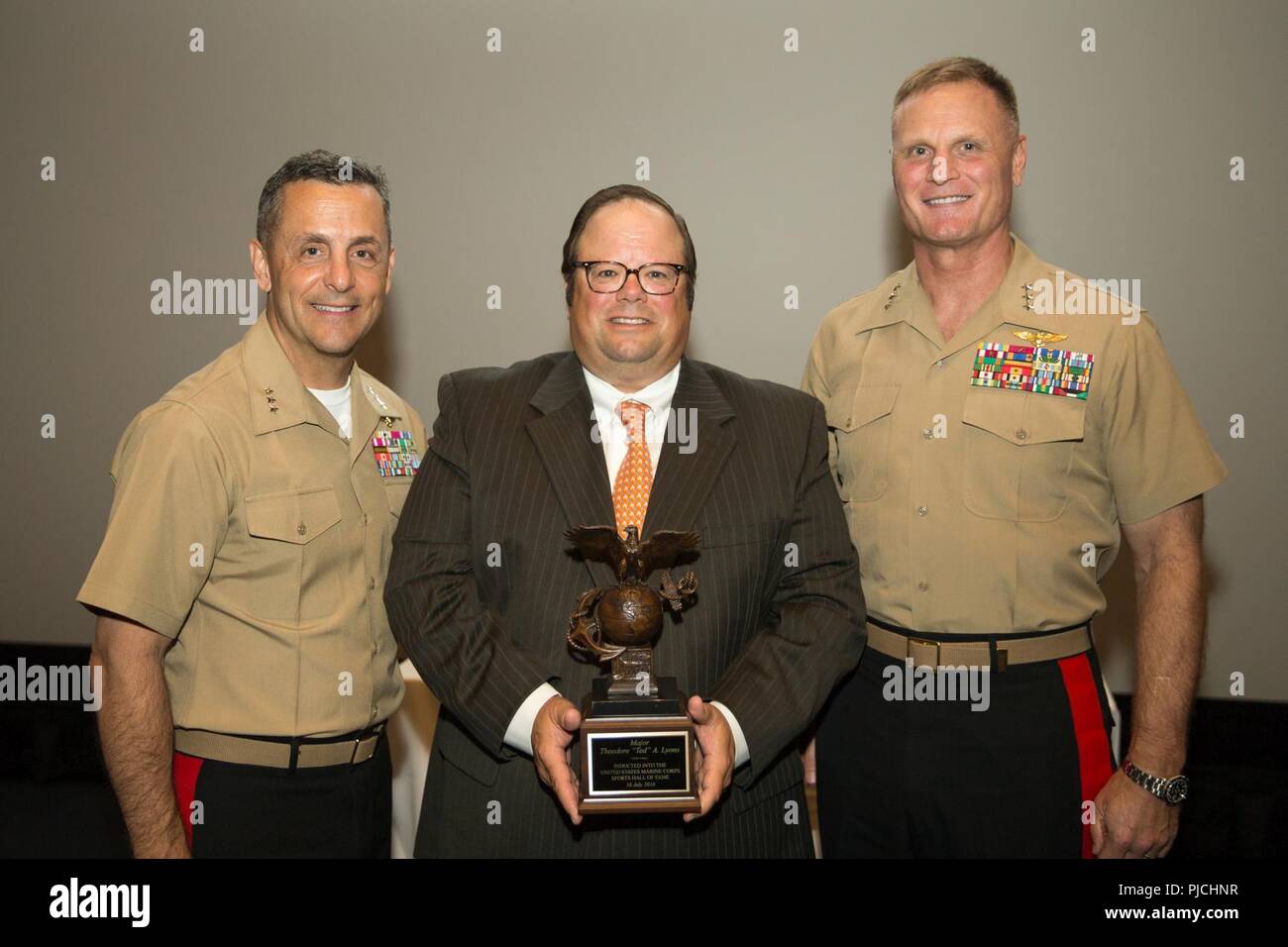 U.S. Marine Corps Lt. Gen. Michael A. Rocco, left, deputy commandant, Manpower and Reserve Affairs, poses with the nephew of Theodore A. Lyons during the 2018 United States Marine Corps Sports Hall of Fame Induction Ceremony at the National Museum of the Marine Corps, Triangle, Va., July 18, 2018. The event was held for the induction of it’s three newest members; James A. Gillcrist, Theodore A. Lyons, and Richard L. Alderson. Stock Photo