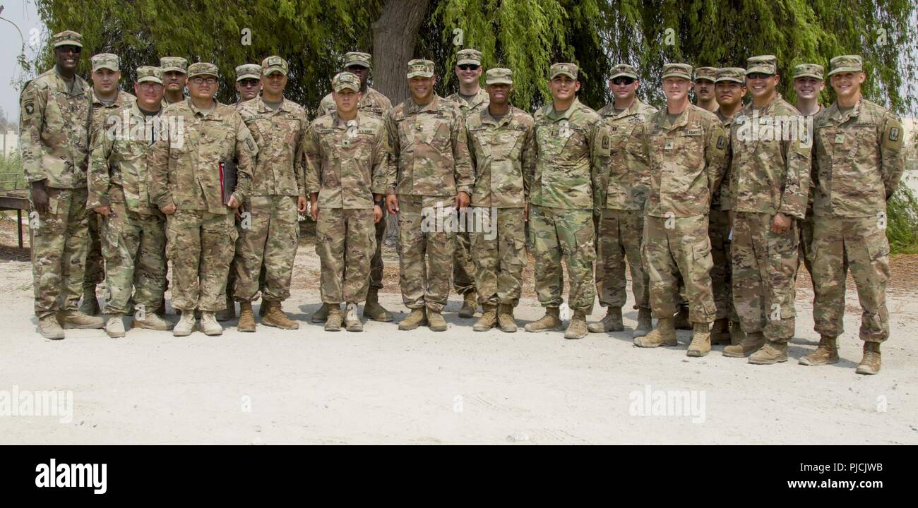 U.S. Army Lt. Gen. Michael X. Garrett, U.S. Army Central (USARCENT) commanding general, poses for a photo with Soldiers assigned to 3rd Battalion, 2nd Air Defense Artillery Regiment, 31st Air Defense Artillery Brigade during a unit visit, July 22, 2018. Lt. Gen. Garrett visited the battalion as part of his battlefield circulation, which enhances his understanding of the units and Soldiers subordinate to USARCENT. Stock Photo