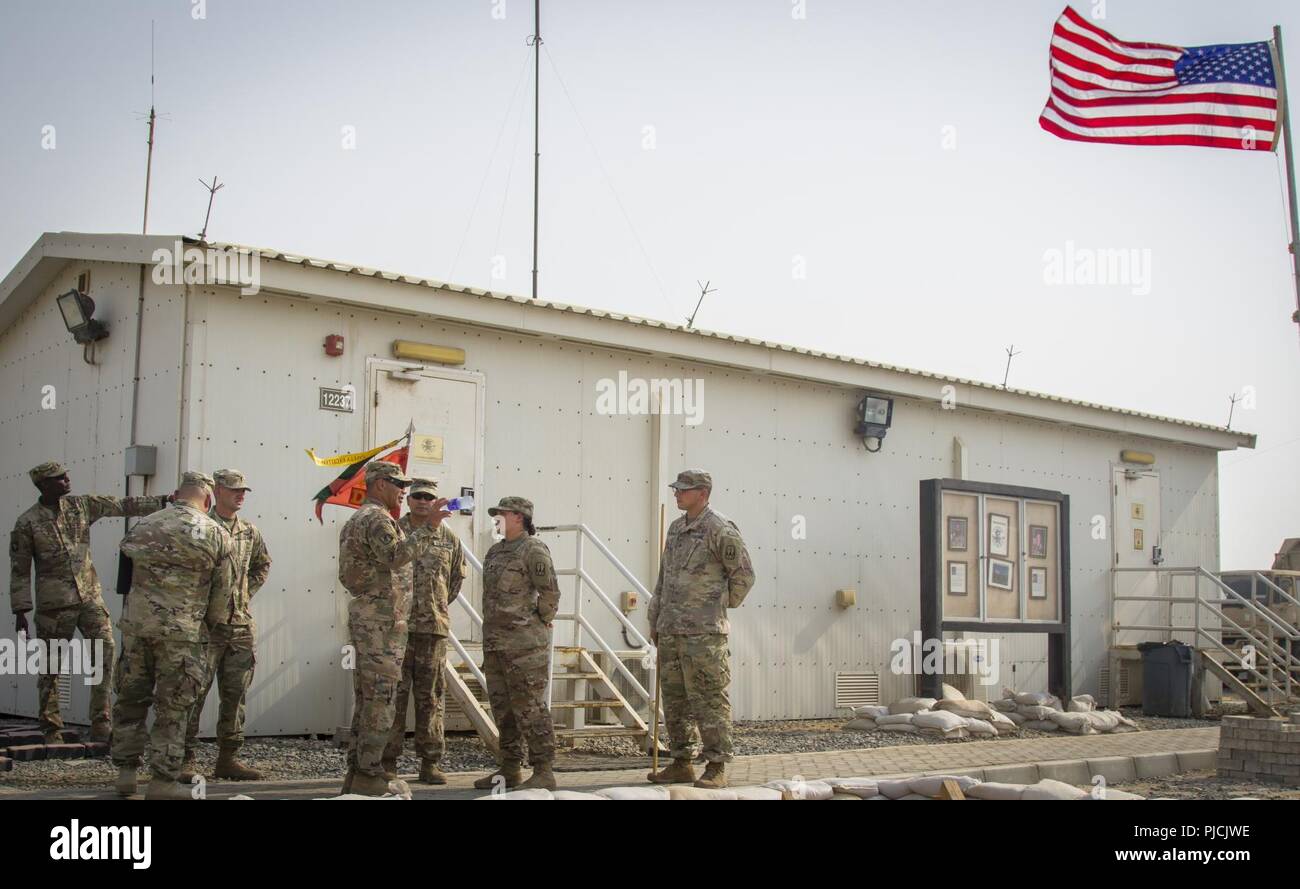U.S. Army Lt. Gen. Michael X. Garrett, U.S. Army Central (USARCENT) commanding general, speaks with U.S. Army 1st. Lt. Abigail Neddermeyer assigned to Delta Battery, 3rd Battalion, 2nd  Air Defense Artillery Regiment during a site overview brief, July 22, 2018. Lt. Gen. Garrett visited the battalion as part of his battlefield circulation, which enhances his understanding of the units and Soldiers subordinate to USARCENT. Stock Photo