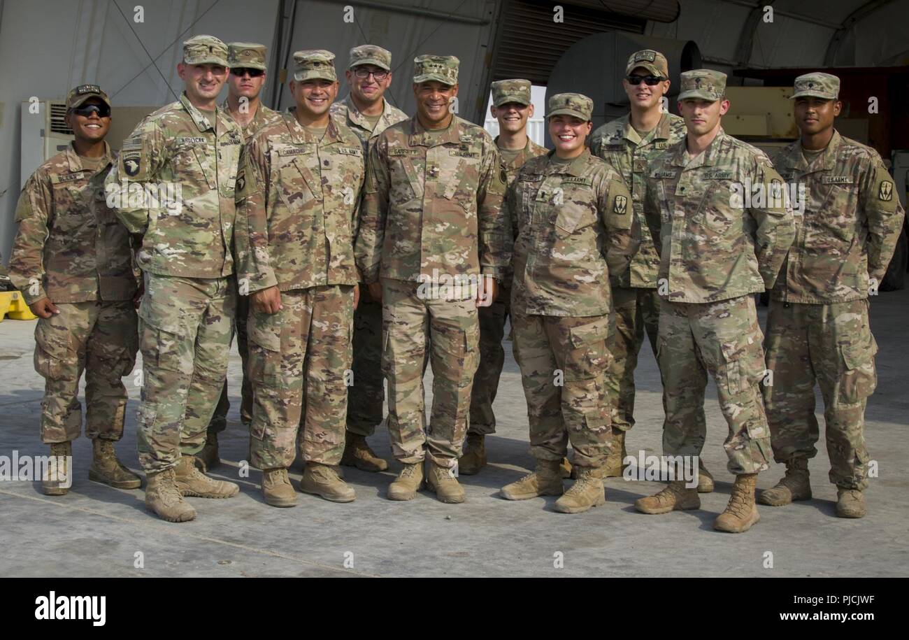 U.S. Army Lt. Gen. Michael X. Garrett, U.S. Army Central commanding general, poses for a photo with Soldiers assigned to 3rd Battalion, 2nd Air Defense Artillery Regiment, 31st Air Defense Artillery Brigade, July 22, 2018. Lt. Gen. Garrett visited the battalion as part of his battlefield circulation, which enhances his understanding of the units and Soldiers subordinate to USARCENT. Stock Photo