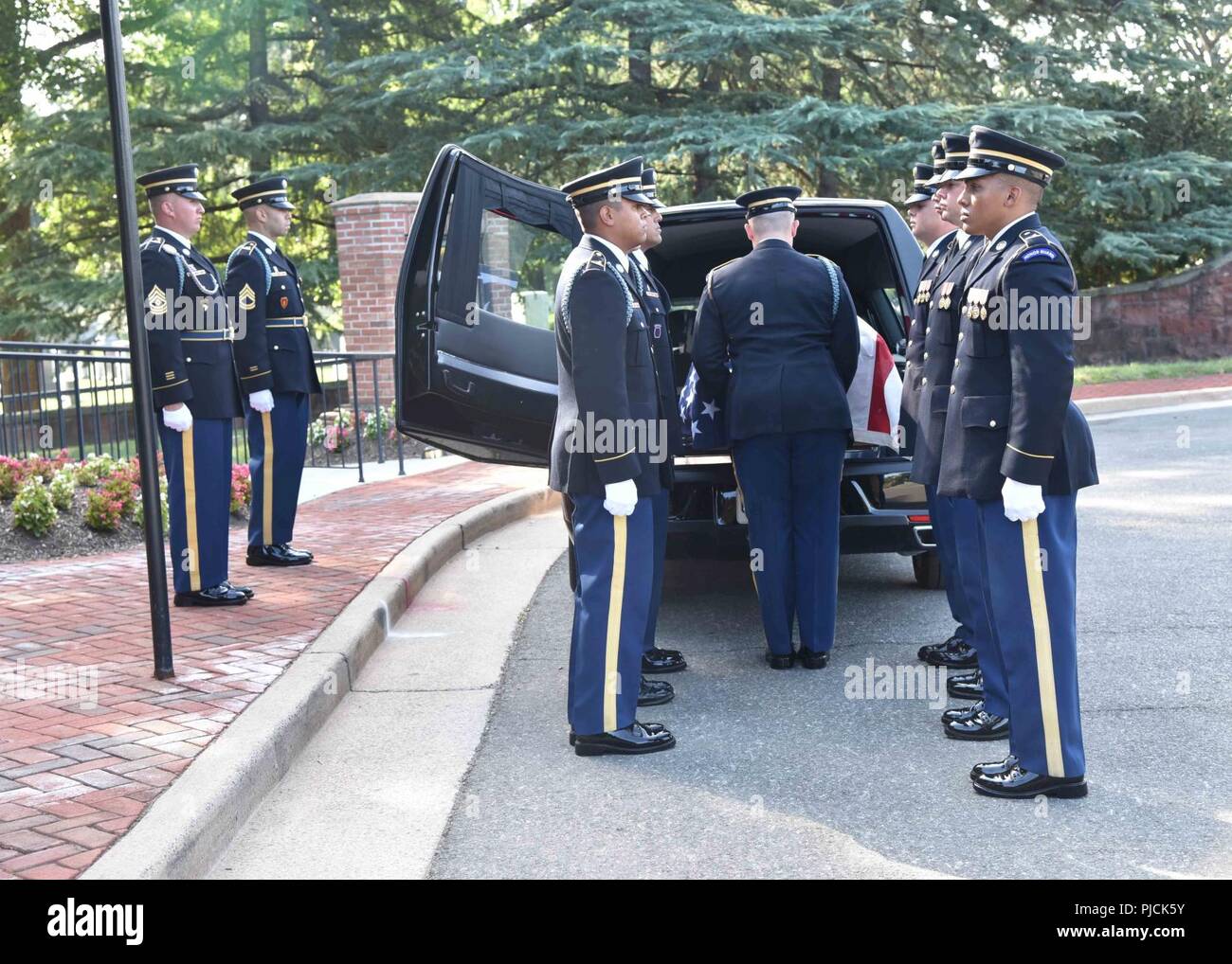 Soldiers with the 3rd Infantry Regiment (The Old Guard) carry the casket of Army Pfc. Walter W. Green, during his funeral at Arlington National Cemetery, July 20.  In November 1950, Green was a member of Company E, 2nd Battalion, 8th Cavalry Regiment, 1st Cavalry Division, participating in combat actions against the Chinese People’s Volunteer Forces (CPVF) in the vicinity of Unsan, North Korea.  Green, 18, of Zanesville, Ohio, was reported missing in action as of Nov. 2, 1950 when he could not be accounted for by his unit.  He was recently identified through DNA and anthropological analysis by Stock Photo