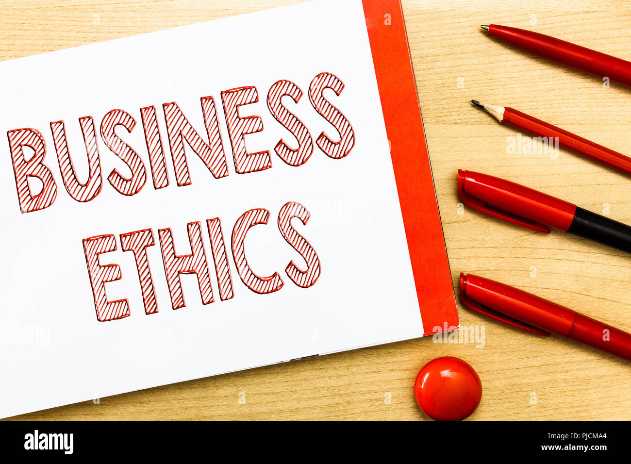 Handwriting text writing Business Ethics. Concept meaning Moral principles that guide the way a business behaves. Stock Photo