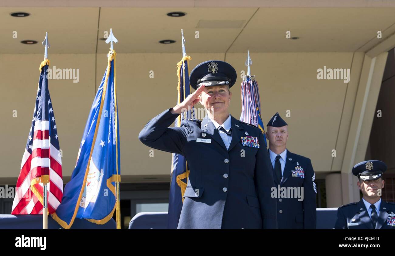 Col. Kristen Beals, 60th Medical Group commander, renders her first salute during the 60th MDG change of command ceremony at Travis Air Force Base, Calif., July 24, 2018. Col. Ethan Griffin, 60th Air Mobility Wing commander, was the presiding officer for the ceremony. Stock Photo