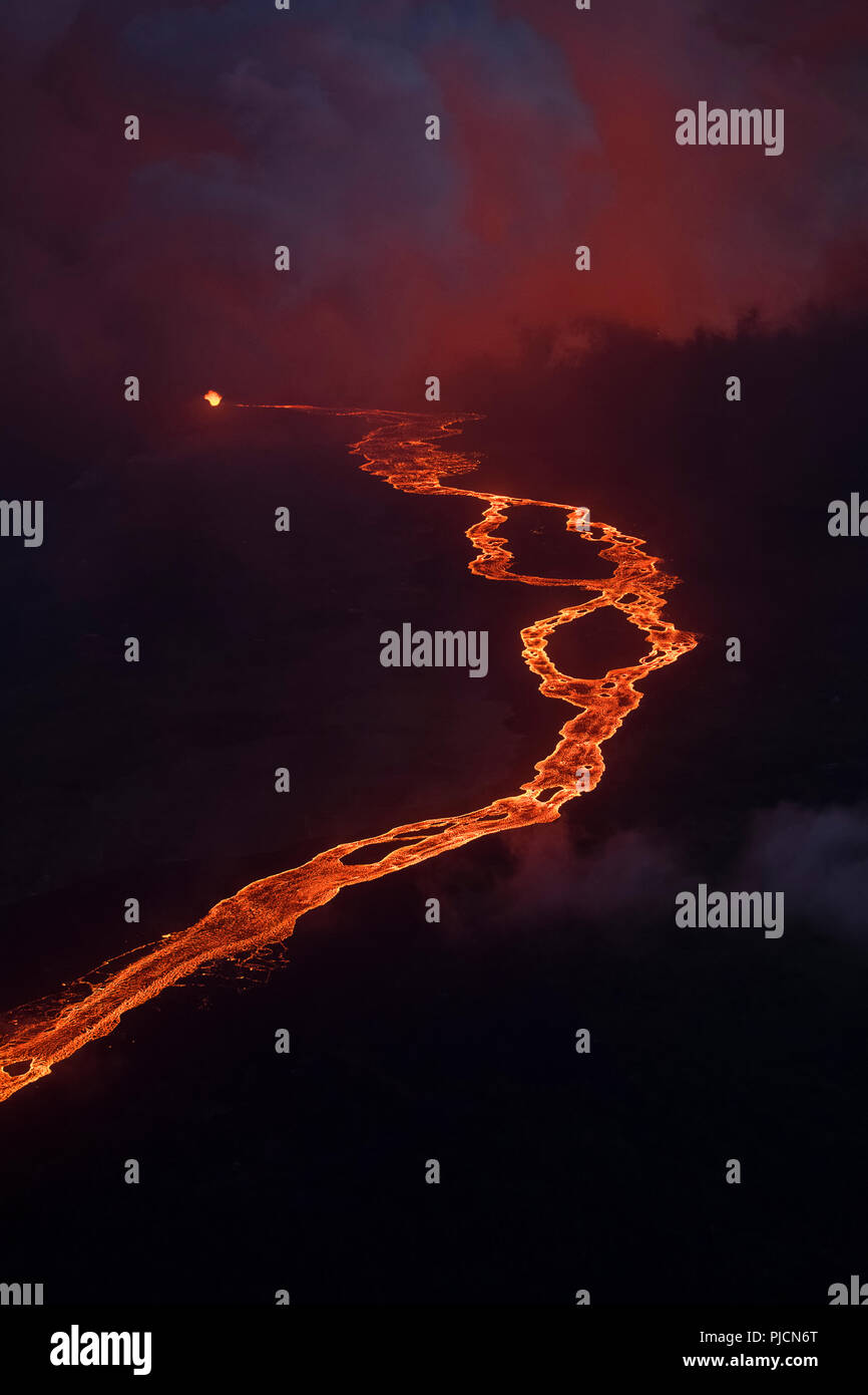aerial view of lava river originating from Kilauea Volcano, erupting as fountains from fissure 8 in Leilani Estates subdivision, near Pahoa, sending a Stock Photo