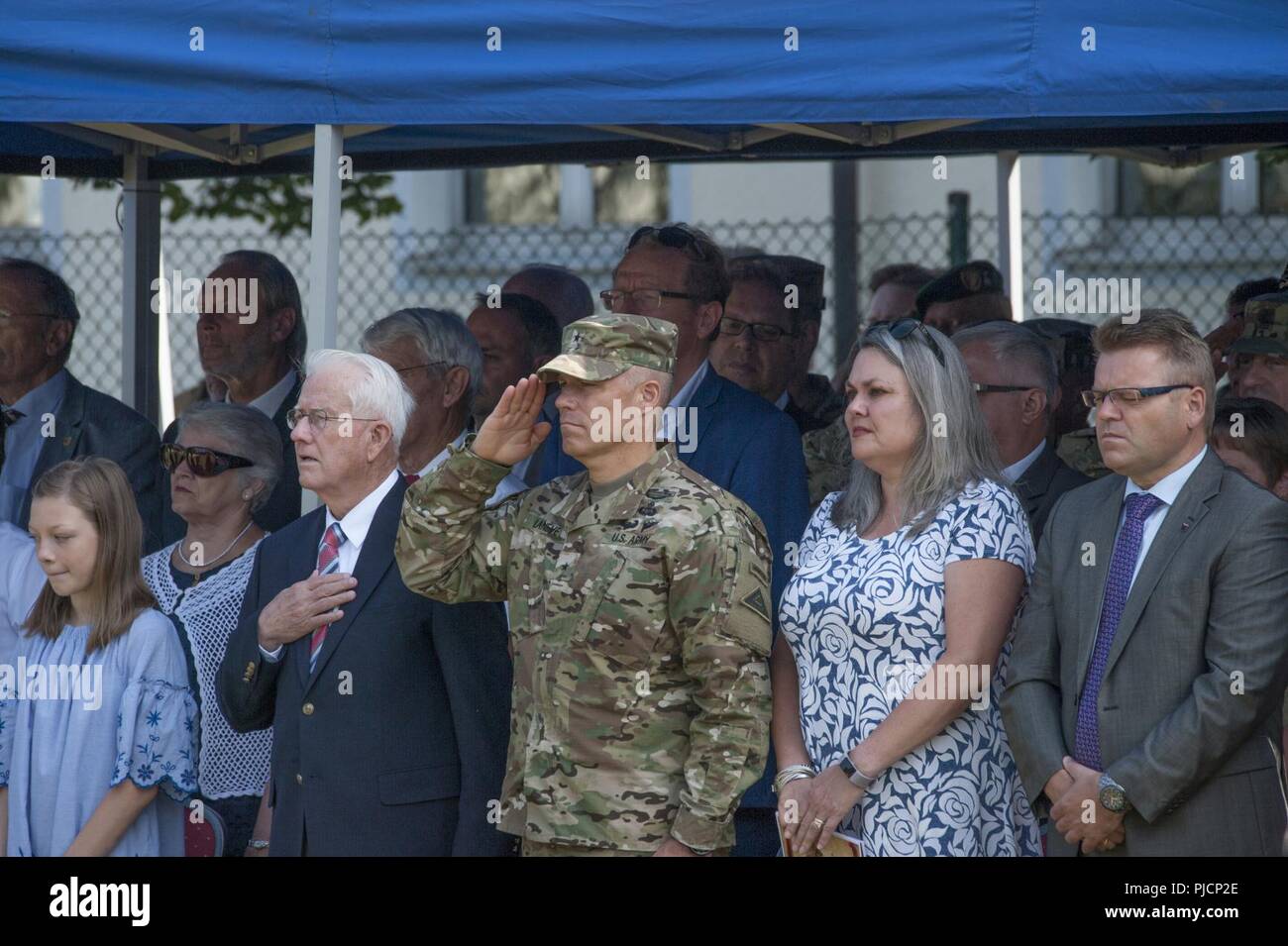 Ansbach, Germany -- U.S. Army Brig. Gen. Christopher C. Laneve, Commanding General of the 7th Army Training Command renders a salute during the United States Army Garrison (USAG) Ansbach Change of Command ceremony at Barton Barracks parade field, Ansbach, Germany, July 18, 2018. During the ceremony USAG Ansbach outgoing commander Col. Benjamin C. Jones relinquished command to incoming commander Col. Steven M. Pierce. Stock Photo