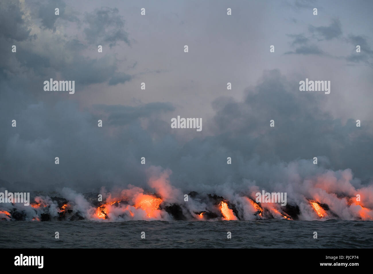 lava enters the ocean along a broad front where a lava river from the