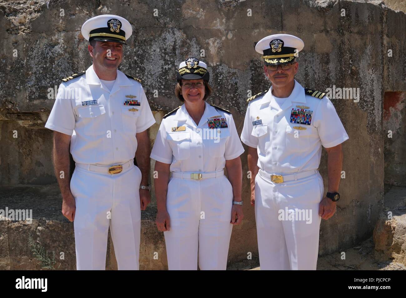 Commander, U.S. 6th Fleet, Vice Admiral Lisa M. Franchetti joins Naval Computer and Telecommunications Station Commanding Officer, Commander Manny Cordero, and Executive Officer, Lieutenant Commander James A. Scianna, for the 75th anniversary of the commencement of Operation Husky and the battle of Ponte Dirillo. Stock Photo