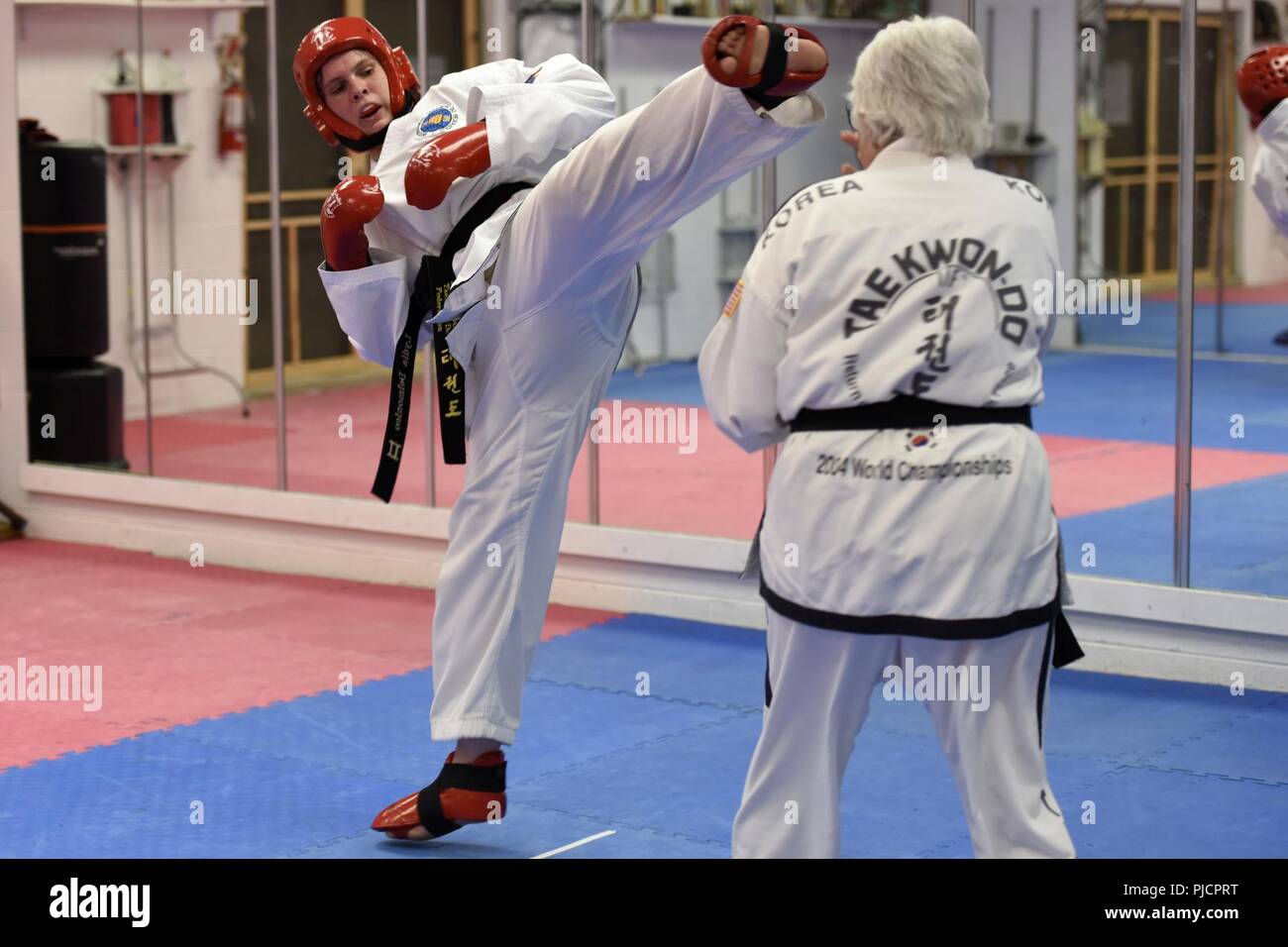 1st Class Lydia Delmonico, an information technology specialist assigned to the 180th Fighter Wing, Ohio Air National Guard, trains for the International Taekwondo Federation World Championships by sparring against her instructor at Great Lakes Global Taekwondo in Sylvania, Ohio, July 11,2018. The ITF World Championships take place from July 31through Aug. 5 in Buenos Aires, Argentina. Stock Photo