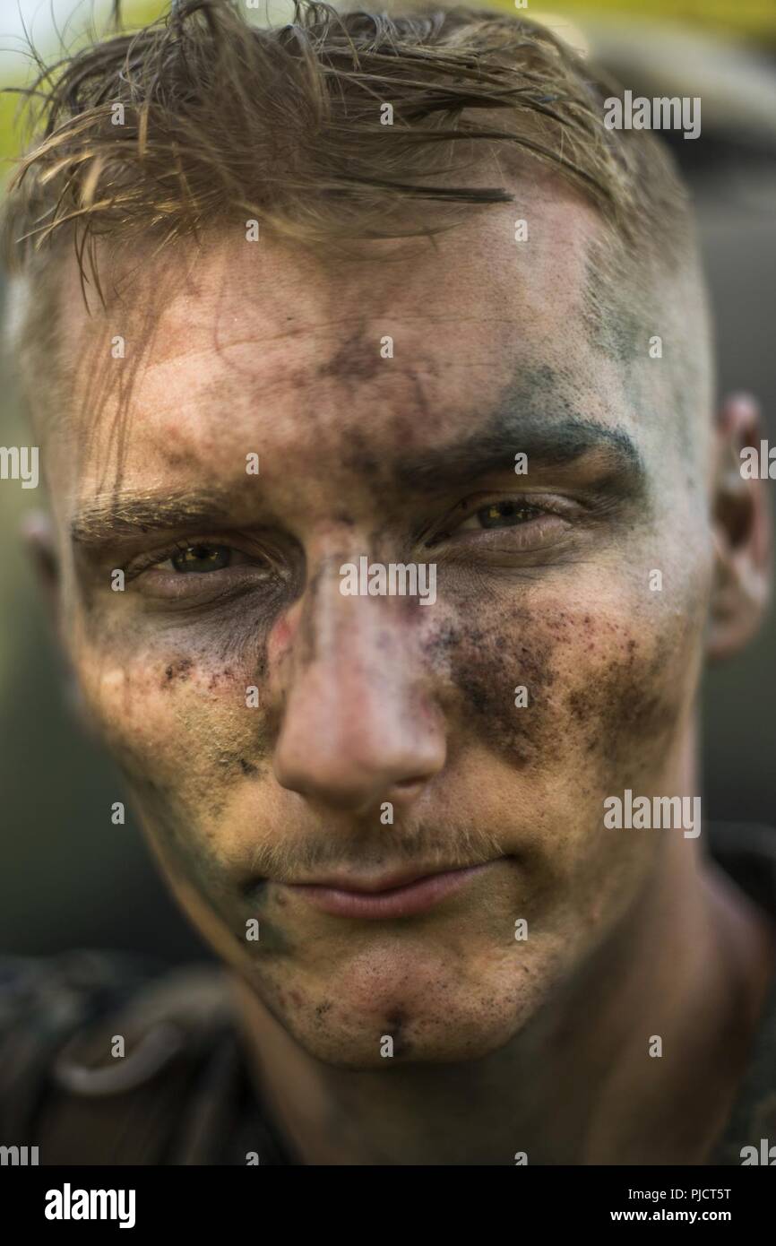 U.S. Marine Cpl. Robert Kaufman, a combat engineer with Bridge Company, 6th Engineer Support Battalion, 4th Marine Logistics Group, poses for a portrait after setting up a forward command and control center during River Assault 2018 at Fort Chaffee, Ark., July 15, 2018. River Assault 2018 is a three-week joint service training exercise with Marines from 7th and 6th ESB working alongside various U.S. Army Reserve units to build a continuous span bridge across the Arkansas River. Stock Photo