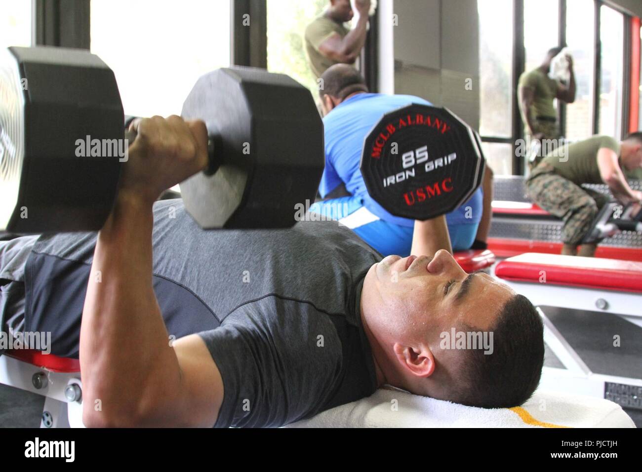 A handful of Marines participate in a weightlifting competition held at