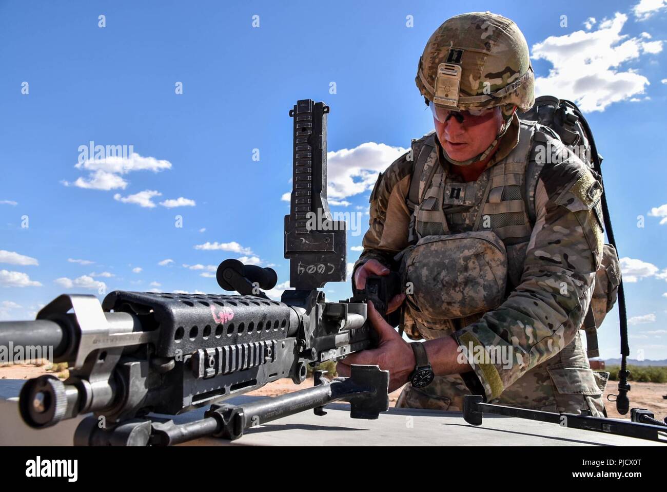 Capt. Zachary Wielepski, 32d AAMDC, HHB commander, assembled and disassembled multiple weapons systems during the situational training (STX) lanes July 18, 2018. “My favorite public affairs non-commissioned officer is Sgt. La’Shawna Custom,” said Wielepski humorously. “She loves to take pictures of me all the time.” Stock Photo