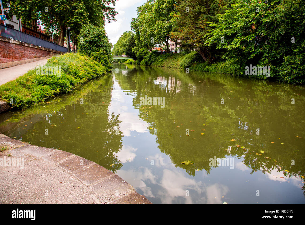 The Canal du Midi flowing through Toulouse France Stock Photo
