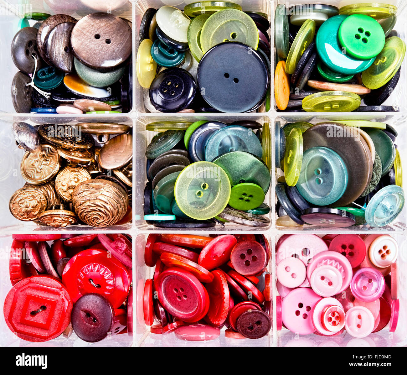 A variety of colourful buttons in bins. Stock Photo
