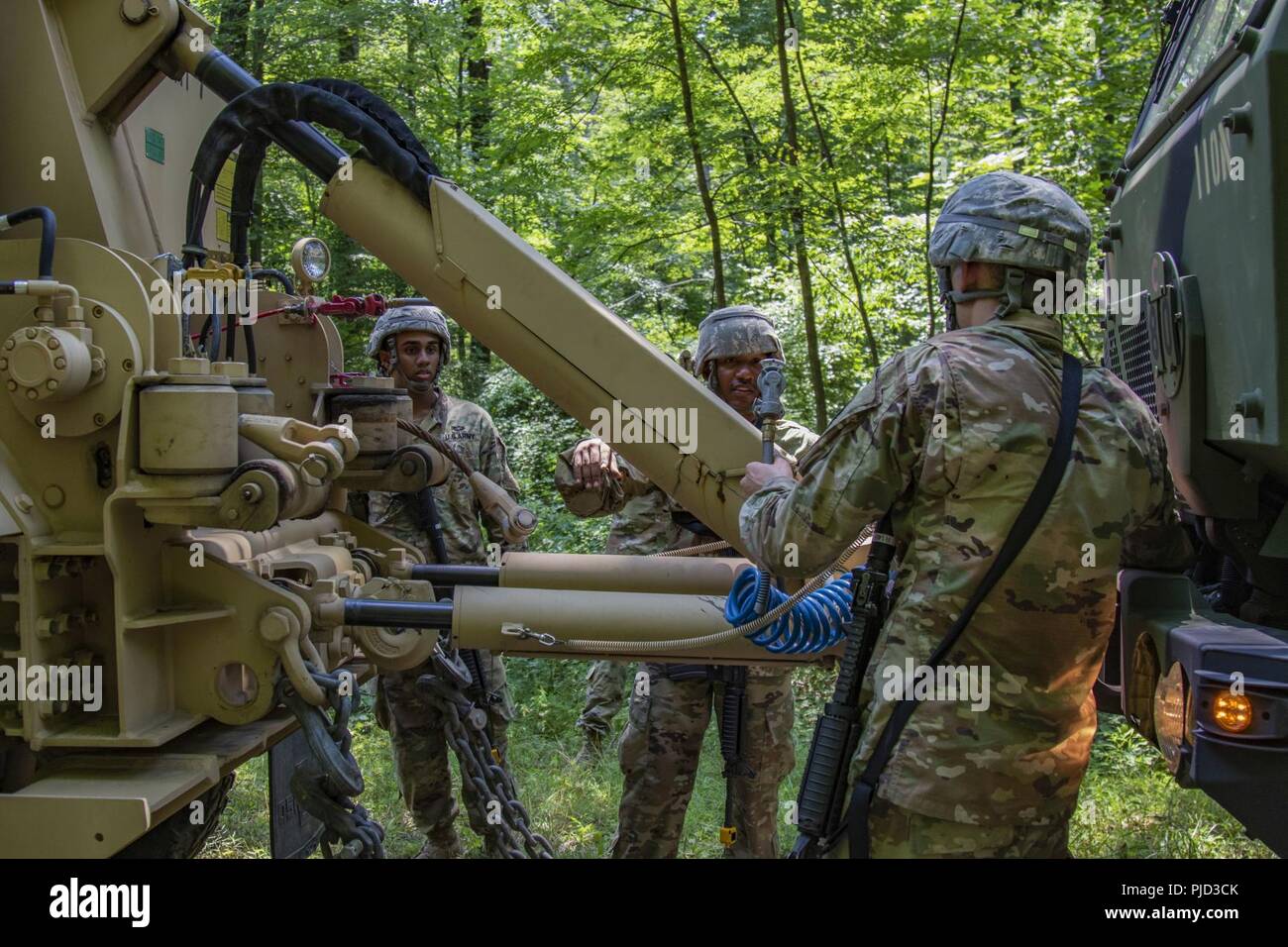 New York Army National Guard Soldiers with the 1569th Transportation Company, 369th Sustainment Brigade, New York Army National Guard, use a M1089 Wrecker to recover a damaged vehicle during their annual training at Fort Indiantown Gap, P.A. on July 16, 2018. More than 370 New York Army National Guard Soldiers from military police, engineer and transportation companies used this year’s three weeks of summer training and the improved multi-million dollar facilities at Fort Indiantown Gap to hone their skills in July 2018 Stock Photo