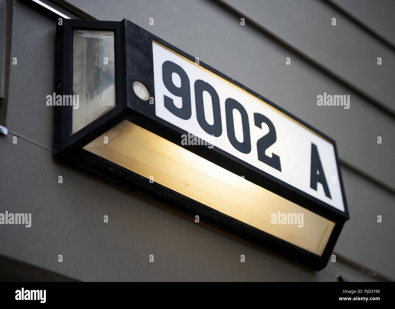 The address to the final housing unit is on display during a ceremony