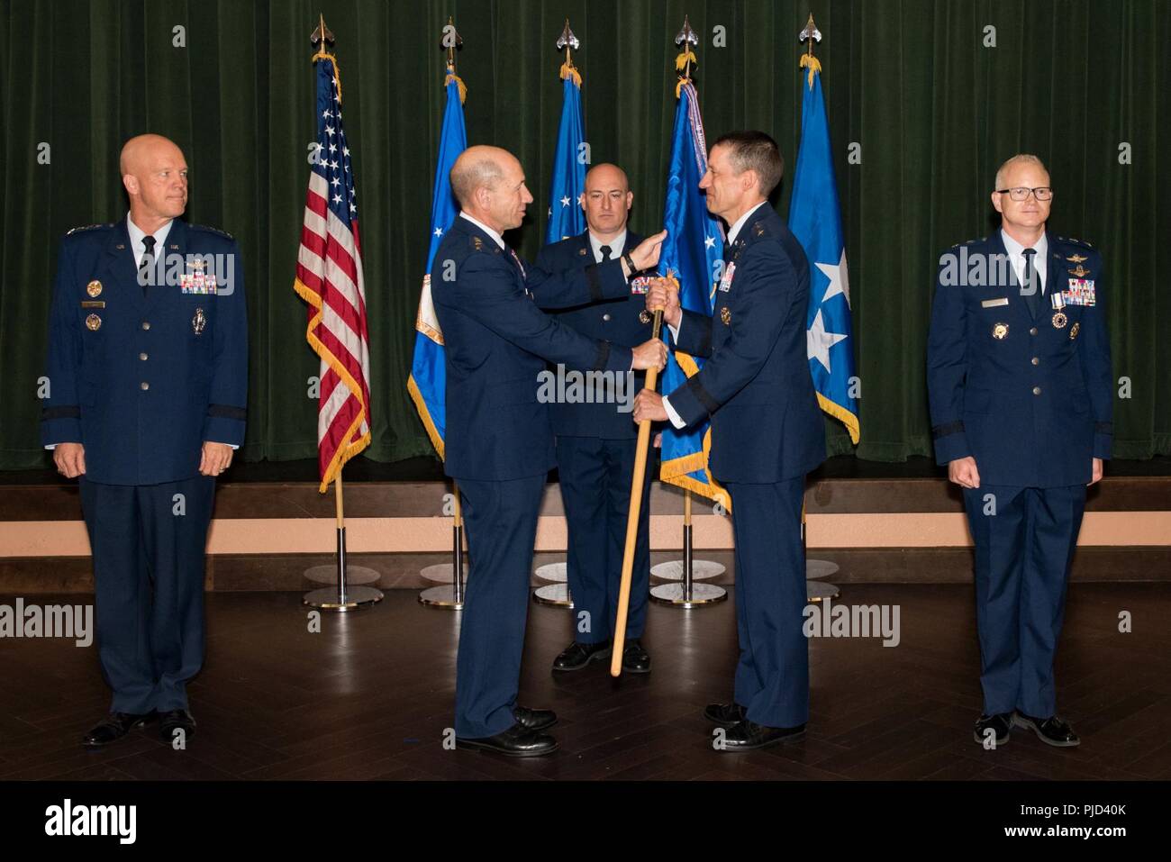 Gen. Mike Holmes, commander of Air Combat Command, presents the 24th Air Force guidon to Maj. Gen. Robert Skinner upon assuming command of the 24th AF during a ceremony at Joint Base San Antonio-Lackland, Texas, July 17, 2018. Twenty Fourth Air Force was reassigned to a new major command and welcomed Skinner during the ceremony. Stock Photo