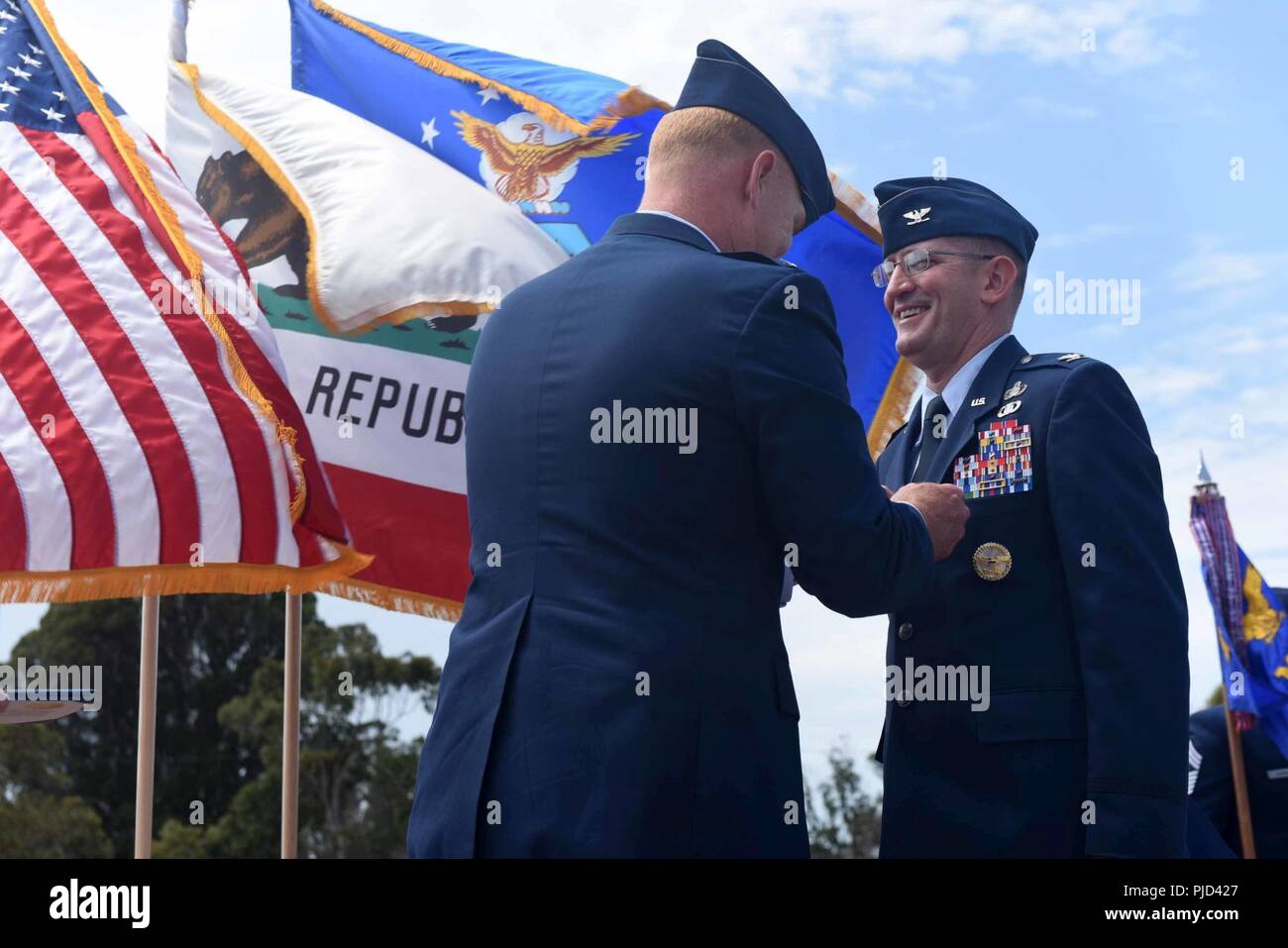 Col Michael Hough 30th Space Wing Commander Presents The Legion Of Merit To Col Paul Nosek 30th Mission Support Group Outgoing Commander During The 30th Msg Change Of Command Ceremony On July