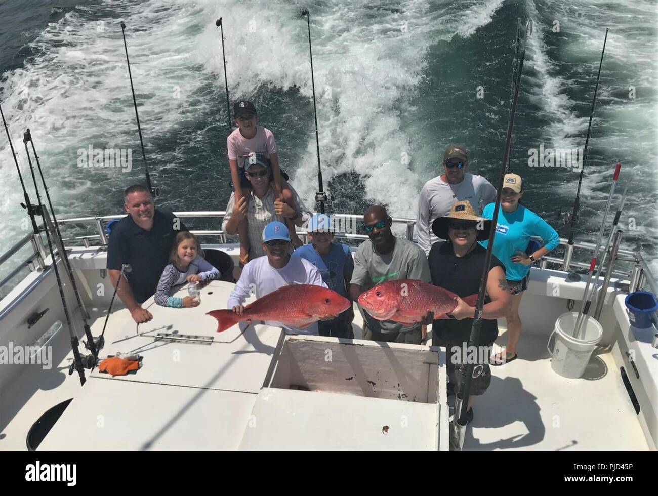 BEACH, Ala. (July 18, 2018)  Members of the Center for Information Warfare Training’s (CIWT) chief’s mess and wardroom participate in a deep sea fishing teambuilding event on the sea in the waters of the Gulf of Mexico. CIWT delivers trained information warfare professionals to the Navy and joint services, enabling optimal performance of information warfare across the full spectrum of military operations. Stock Photo