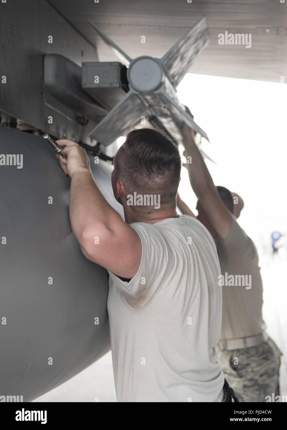 Members of the 44th Aircraft Maintenance Unit mount an AIM-9X heat ...