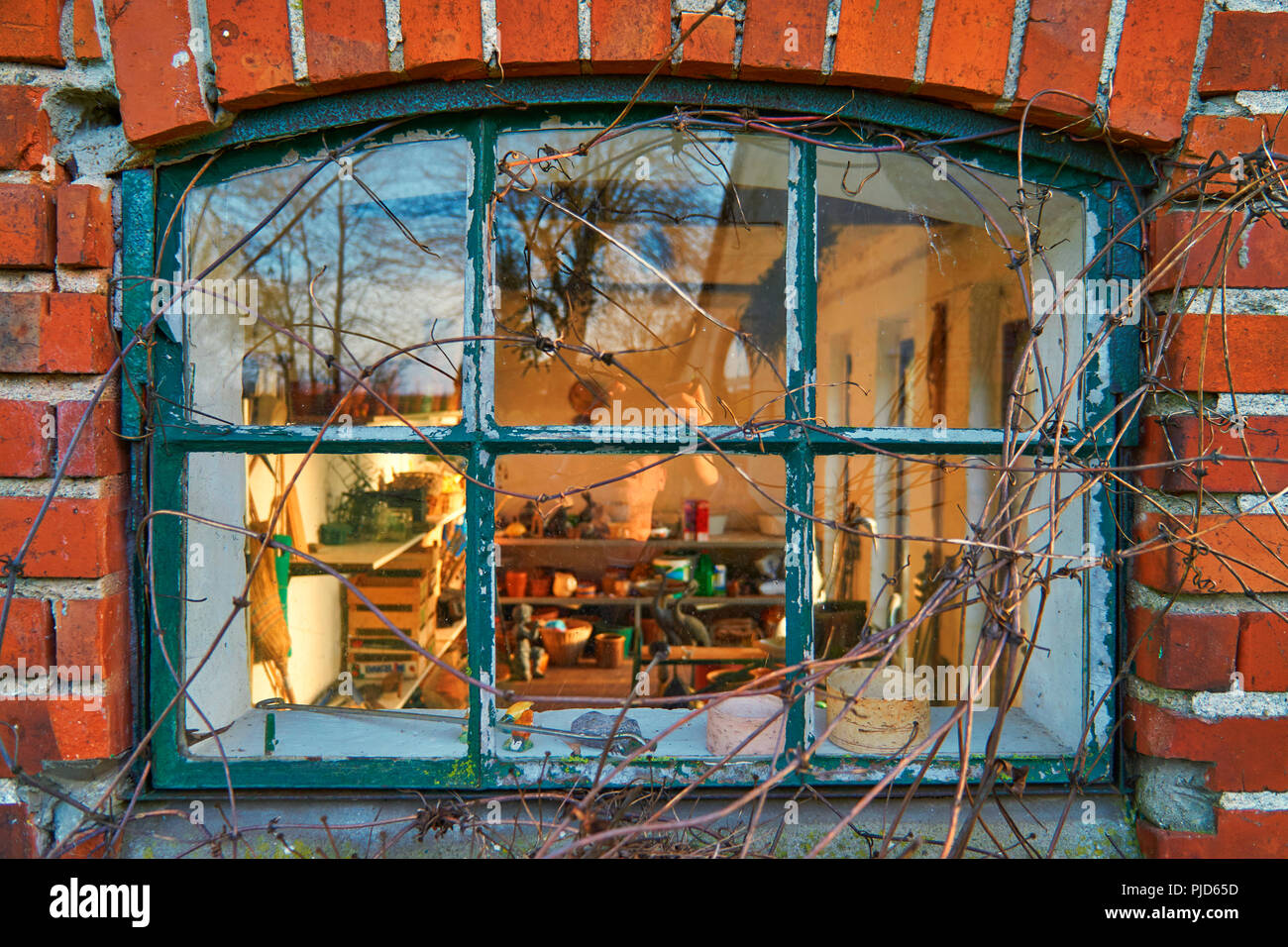 Old leaded painted wood window in an arched red brick wall Stock Photo ...