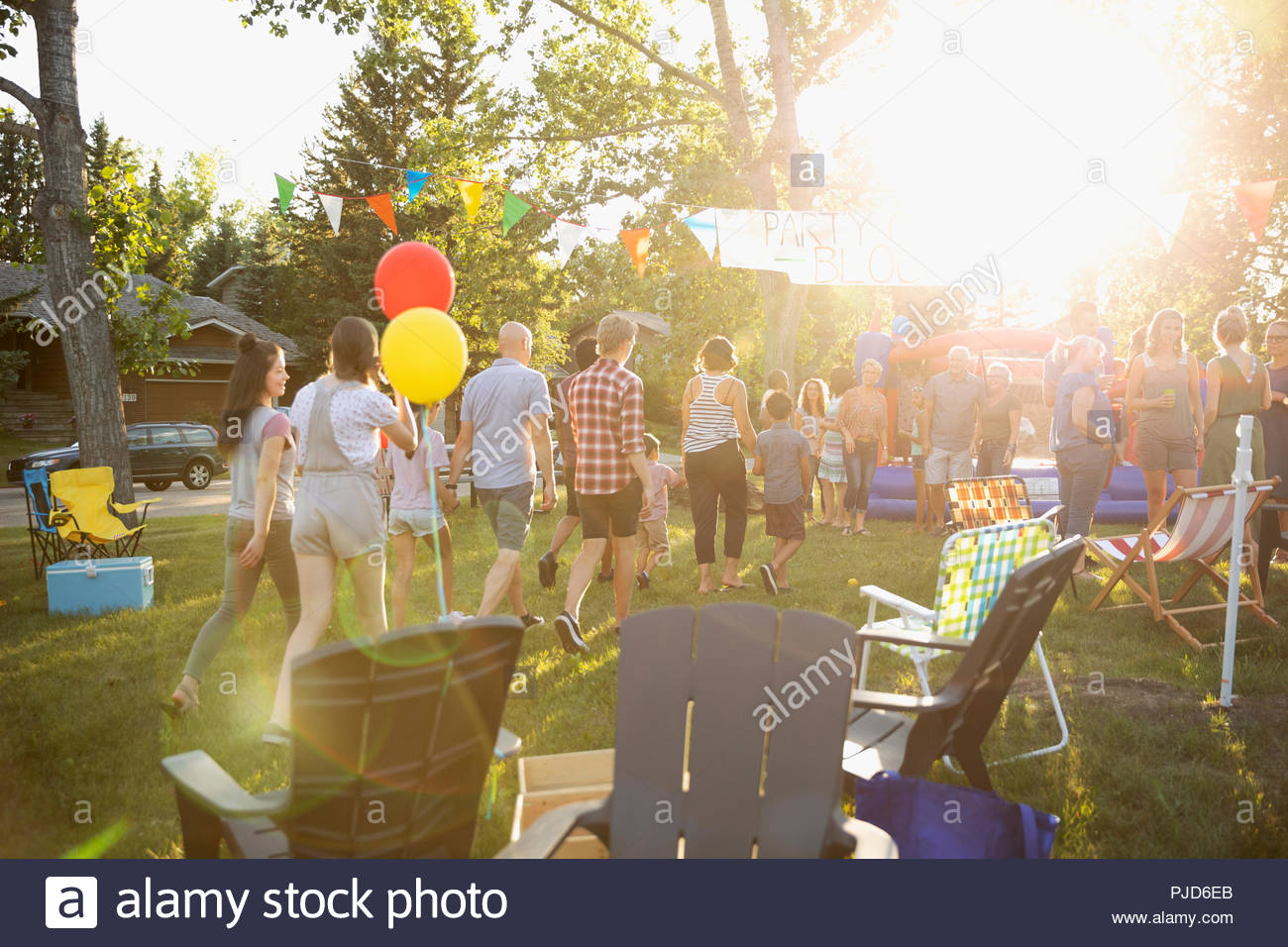 Neighbors enjoying summer neighborhood block party in sunny park Stock Photo Alamy
