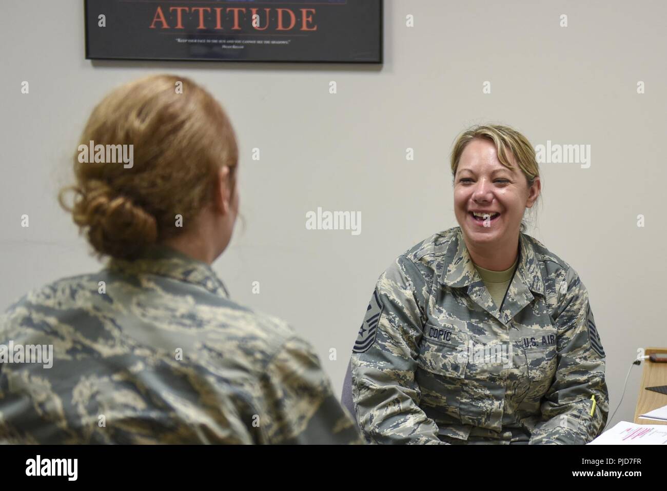 Sgt. Kristy Copic, the 180th Fighter Wing Medical Group’s first sergeant, speaks with an Airman who is new to the 180FW Medical Group on July 15, 2018. The first sergeant is a special duty, reporting directly to the squadron commander on matters of morale, welfare and conduct. They are also the principal advisor to the commander about their Airmen. Stock Photo