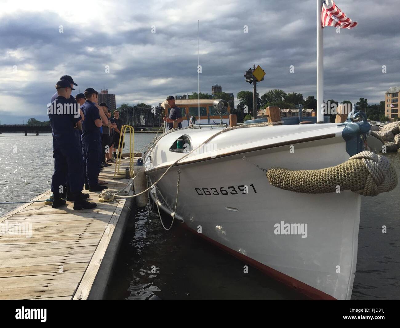 The crew of Coast Guard Station St. Joseph tour the fully restored 36-foot Motor Life Boat CG36391 in St. Joseph, Michigan, July 20, 2018. The MLB is visiting Coast Guard stations on the Great Lakes. Stock Photo