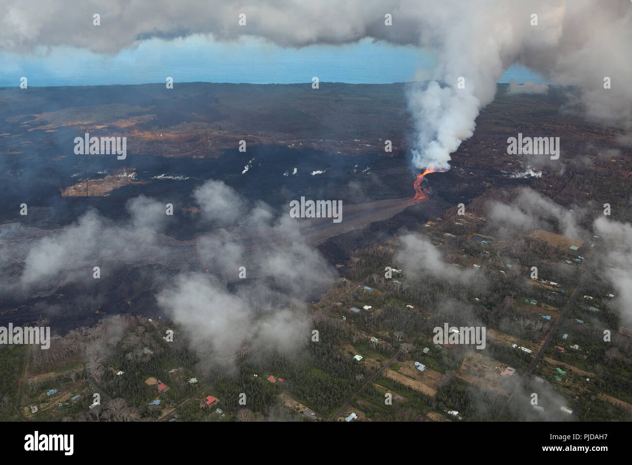 Aerial view of Kilauea Volcano east rift zone erupting hot lava from Fissure 8 in the Leilani Estates residential subdivision near Pahoa, Hawaii Stock Photo