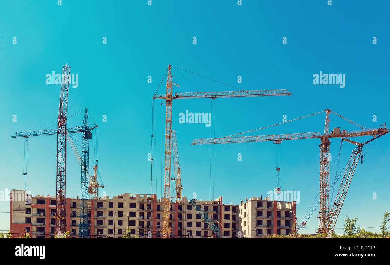 build a house, building site,construction of houses, construction cranes, construction material, city, day roofing Stock Photo