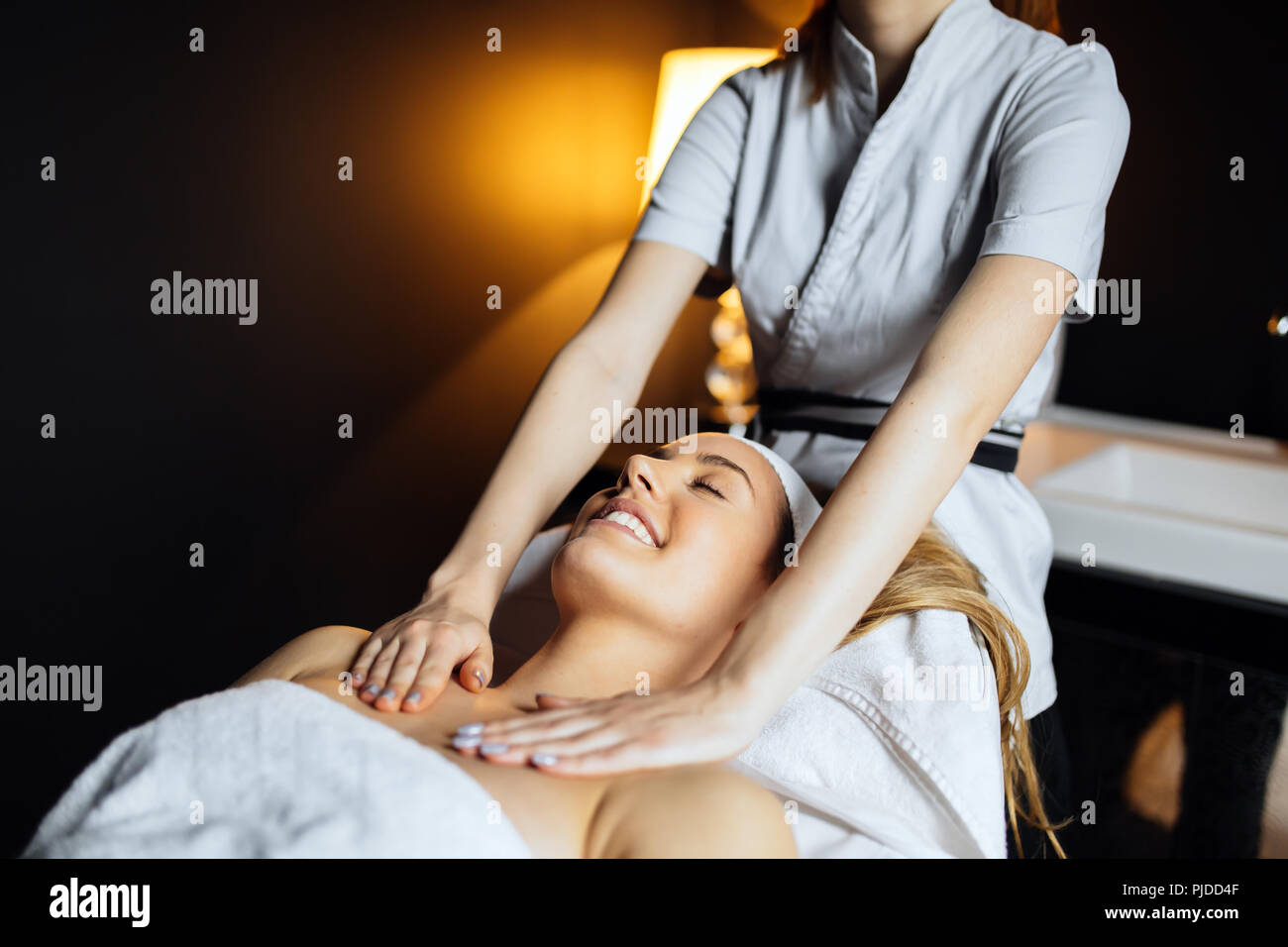 Beautiful woman enjoying massage treatment Stock Photo