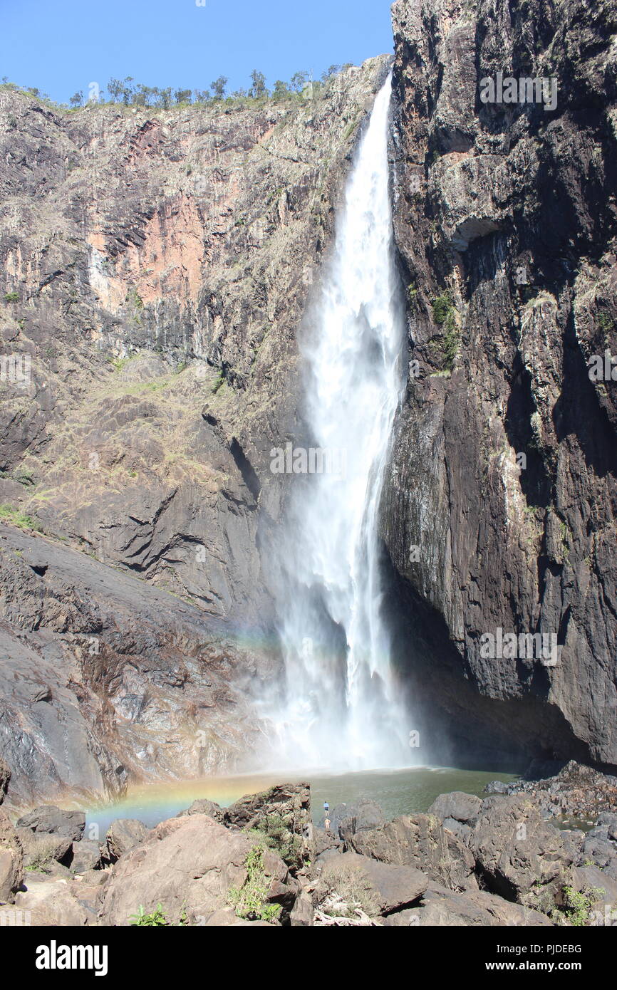 Australia's tallest waterfall- Wallaman falls in Queensland. It stands 286m high, and in the middle of the day, a near-360 degree rainbow is visible. Stock Photo