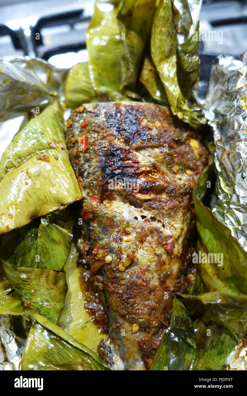 Grilled Fish Wrapped in Banana Leaf Stock Photo