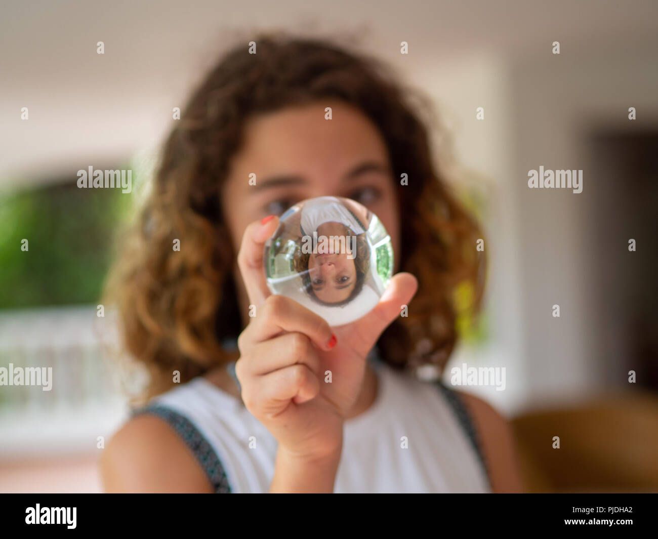 portrait-of-a-10-year-old-girl-blonde-and-with-curls-looking-at-a