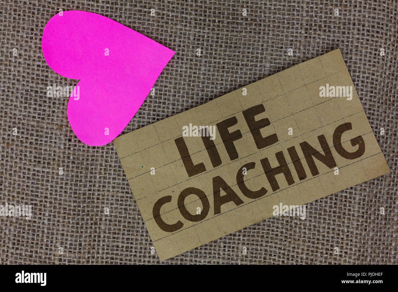 Word writing text Life Coaching. Business concept for Improve Lives by Challenges Encourages us in our Careers Piece squared paperboard paper heart ju Stock Photo