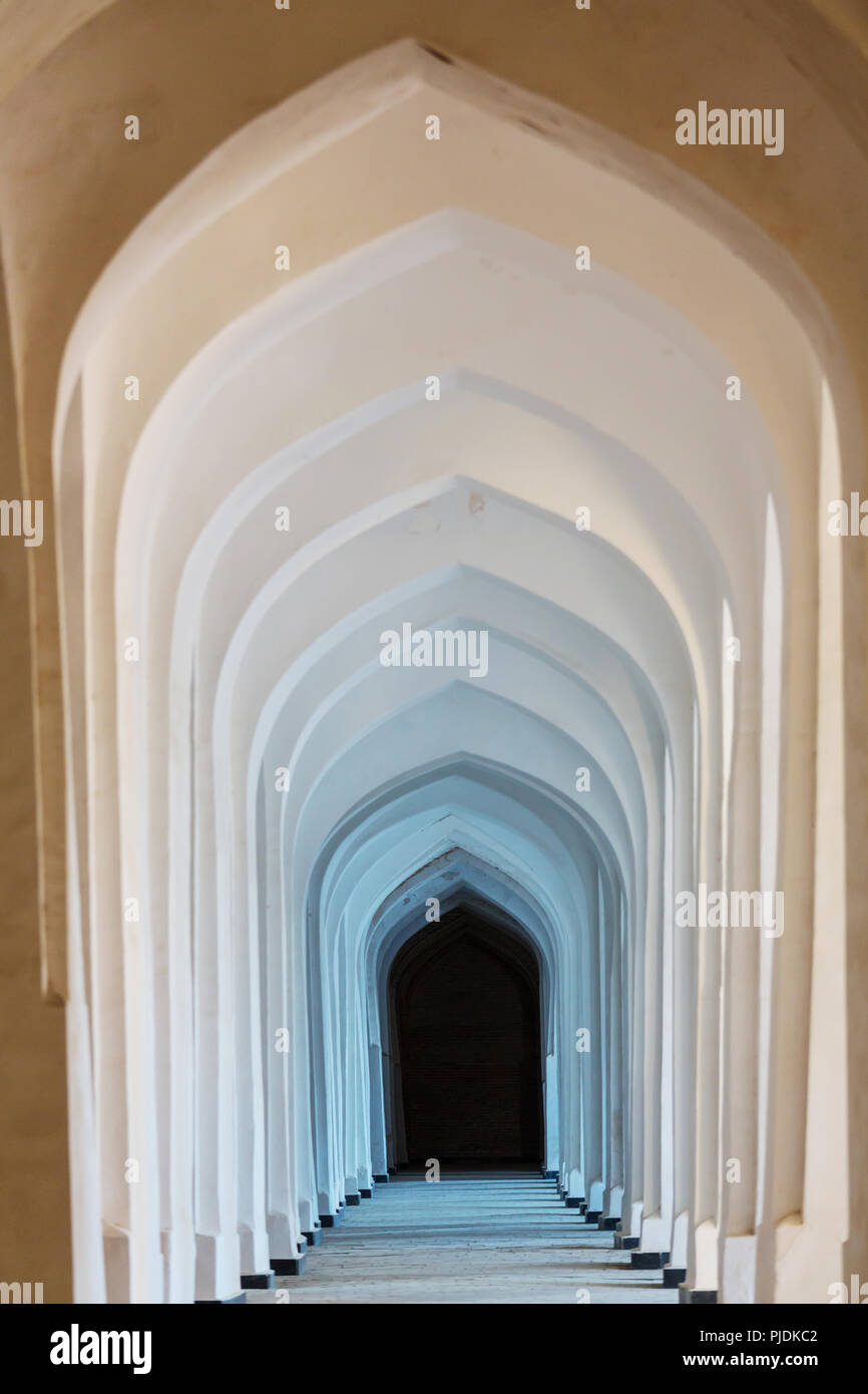 White Arabian arches in Kolon mosque. Bukhara. Uzbekistan. Central Asia ...