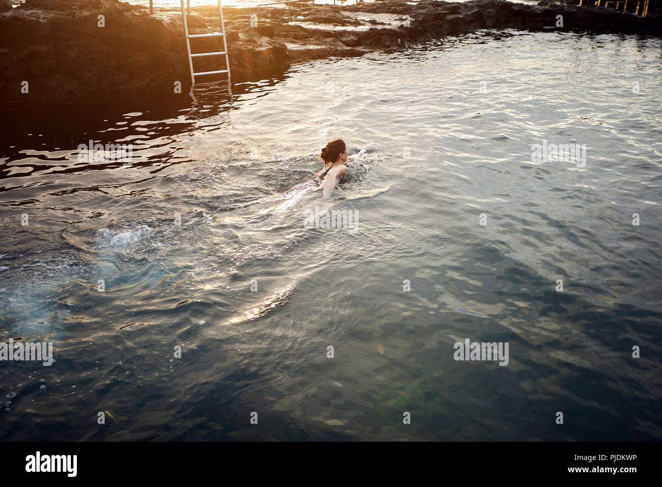 Mature woman in swimming pool hi-res stock photography and images - Alamy