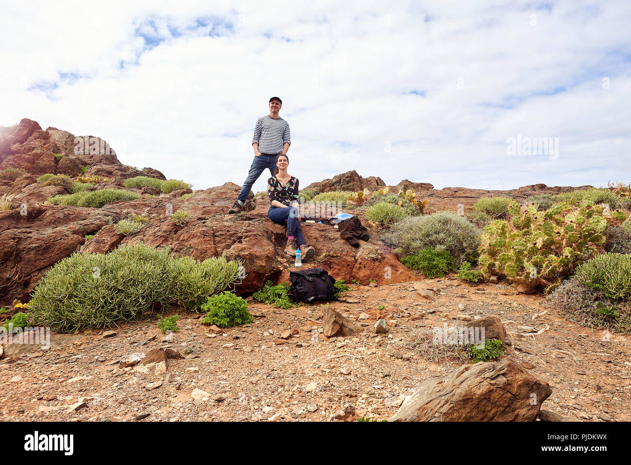 Mature tourist couple in rugged landscape, portrait, Las Palmas, Gran Canaria, Canary Islands, Spain Stock Photo