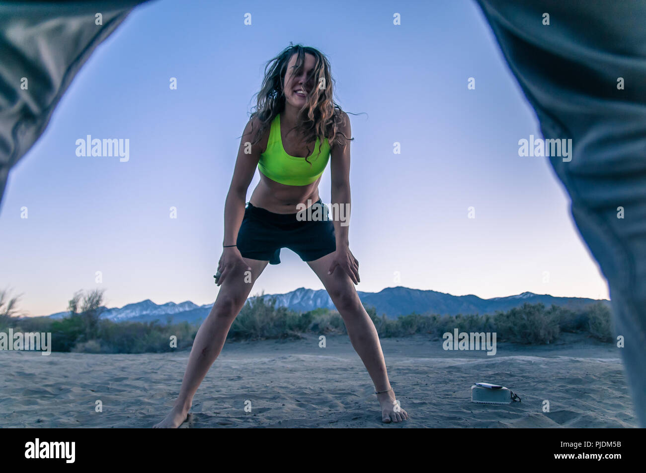 Woman and friend playing at camp area, Bishop, California, USA Stock Photo