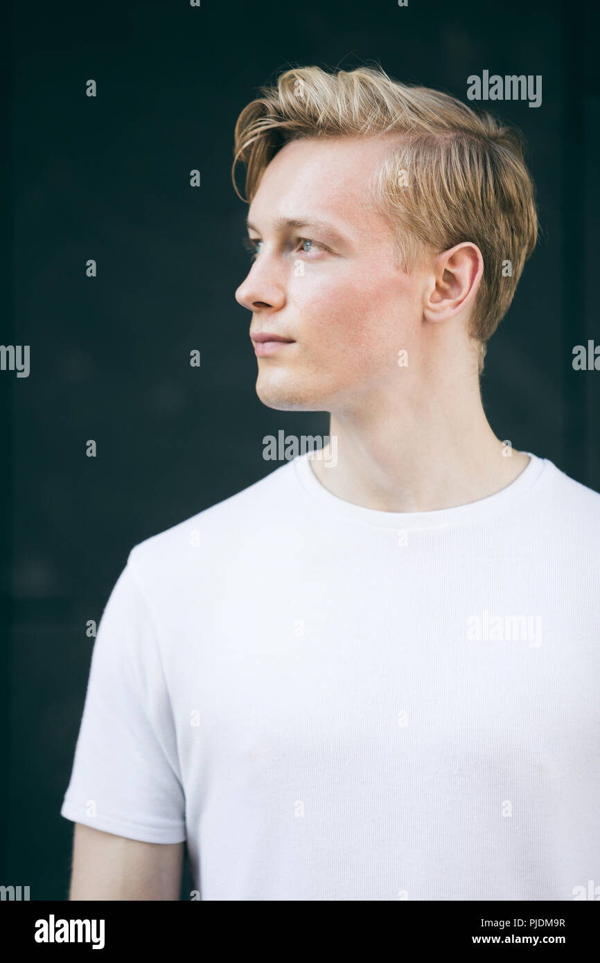 Young man, black background Stock Photo