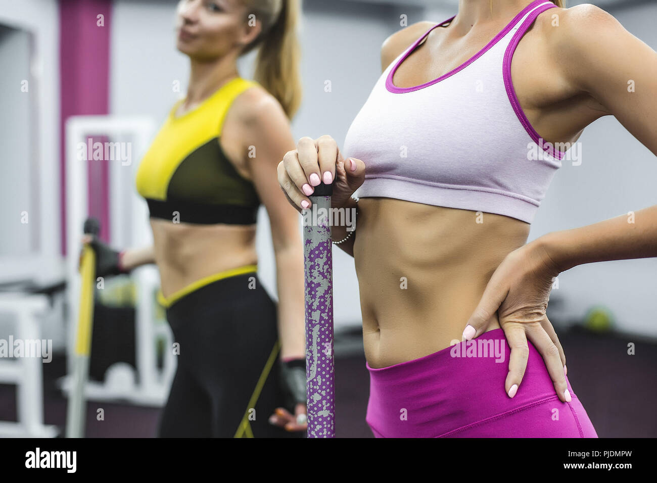 Woman wearing cropped sports top with hand on hip Stock Photo