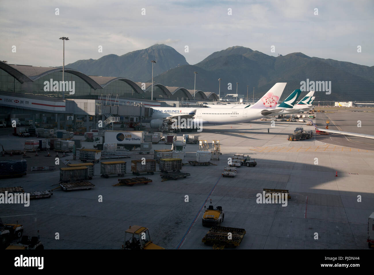 planes and airport vehicles terminal 1 hong kong international airport chek lap kok hong kong china Stock Photo