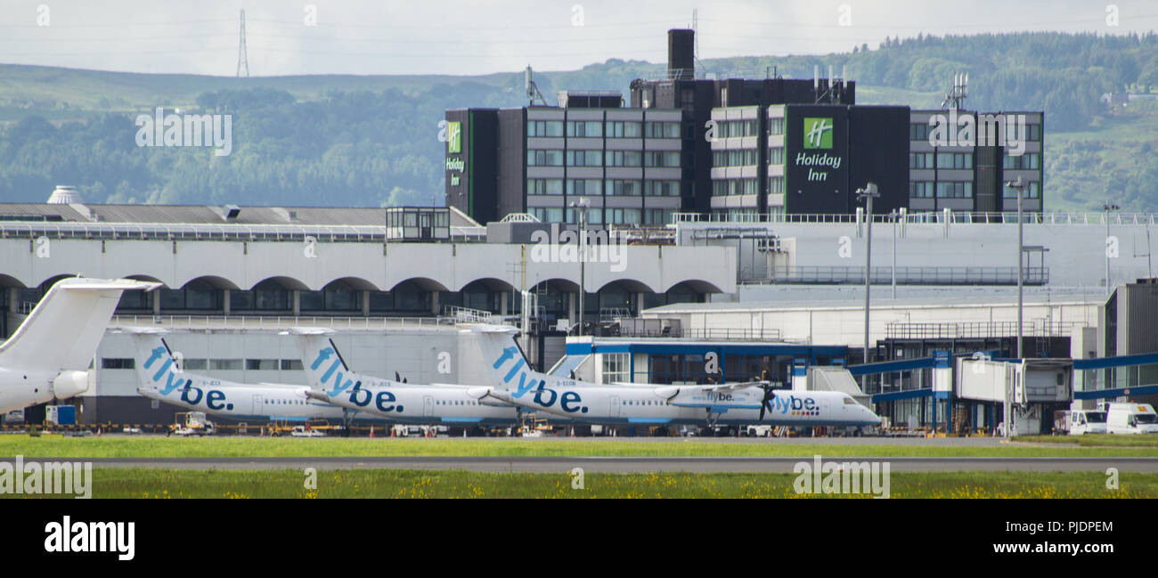 Low cost operator Flybe which use the Bombardier Q400 aircraft, seen Glasgow International Airport, Renfrewshire, Scotland. Stock Photo
